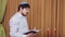 Before the chuppah ceremony, the Jewish groom reads prayers and psalms for siddur in the synagogue hall and makes