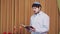 Before the chuppah ceremony, the Jewish groom reads siddur prayers in the synagogue hall