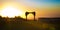 Chuppah silhouetted by the golden setting sun