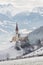 Church with an Alpine mountain background in Austria in winter