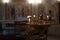 Church altar with alight candles candelabrum burning