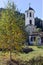 Church of the Assumption, river and Autumn tree in town of Shiroka Laka, Bulgaria