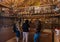 The church attendant talking to visitors in the Church of the Apostles located on the shores of the Sea of Galilee, not far from