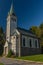 Church in Bedrichov village in autumn sunny evening with sunset light