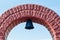 Church bell with an arch against the blue sky in Chernobyl