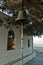 Church bell in front of Agios Ioannis Kastri church at sunset, famous from Mamma Mia movie scenes, Skopelos Island
