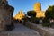 Church with bell tower and sunset tower of the castle of Capdepera Majorca