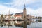 Church and boats in south harbour canal of Harlingen, Netherland