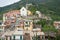 Church built on hillside overlooking traditional fishing village