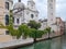 Church, canal,palaces, boats and old brick houses in Venice, Italy, Europe