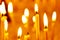 Church candles in an Orthodox church. Worship and religious holidays. Close-up