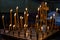 Church candles standing in the temple on the stand during the service.