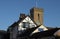 Church clock tower with timber building