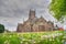 Church with colourful flowers peaceful religious scene in England UK South Molton Devon