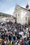 Church and crowd of faithful. Easter in Ortisei, Italy.