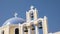 A church dome and four bells in fira, santorini