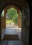 Church door looking out from the Church of The Holy Cross, Bignor, Sussex, UK