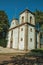 Church facade in baroque style with worn wall