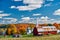 Church and farm with red barn at autumn