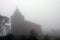 Church in fog. Bokor Hill near Kampot. Cambodia.