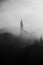 Church in the fog. Monochrome image. Black and white.