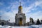 A church with a golden dome and a blue sky.