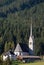 Church on Gosau village outskirts near forest, Austria