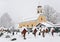 Church and graves in winter covered with snow