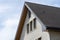 The church has a classic PVC soffit that imitates wood with a white brick facade.