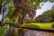 Church among high trees in Giethoorn, Netherlands