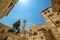 Church of the Holy Sepulchre exterior and minaret under blue sky in Jerusalem, Israel.