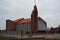 Church house building bricks orange roof cross square