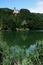 A church with its bell tower on the lake of Castel dell`Alpi