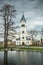 Church in Jesenik over a small pond