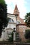 Church, lamppost, trees and palm tree in Vicenza in Veneto (Italy)