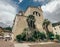 A church-like building near two large palm trees