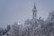 Church like a castle in a fairytale on snow caped hill with frosty forest. Church of Rein at Ruefenach in wintertime, canton