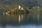 The Church of Mary the Queen on the small island in the middle of Lake Bled in autumn.