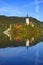 The Church of Mary the Queen on the small island in the middle of Lake Bled in autumn.