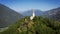 Church of the monks in the mountains of europe dolomites dawn mist aerial drone footage