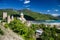 Church of the Mother of God, Ananuri with Zhinvali reservoir dam in the background and blue sky with few clouds above