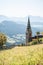 Church on a mountain overlooking valley in Villandro, Dolomites, Italy
