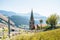 Church on a mountain overlooking valley in Villandro, Dolomites, Italy