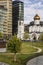 Church next to modern houses. Moscow, Russia, 09/30/2020