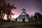 Church at night with star trails