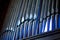 Church organ pipes with blue highlights
