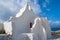 Church of Panagia Paraportiani in Mykonos, Greece. Chapel building with small bell tower. White church architecture on