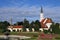 Church and park with flowers and fountain in Vienna