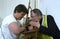 In a church. Priest taking confession from a female parishioner