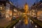 Church reflected in a canal in Delft, The Netherlands